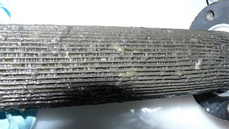 A dirty and blocked hydraulic filter element