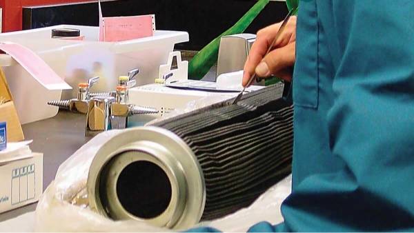 A worker is supervise the machine operation.