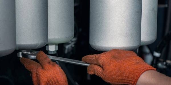 A worker is repairing production equipment.