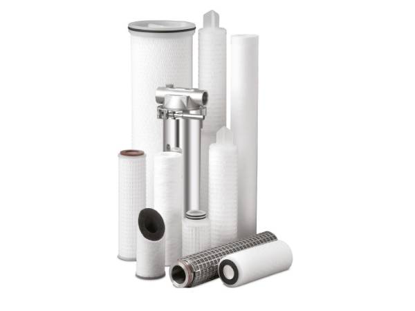 Several different types of water filter cartridges on white background.